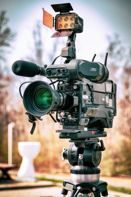 A broadcast camera rigged for multi-camera event coverage
