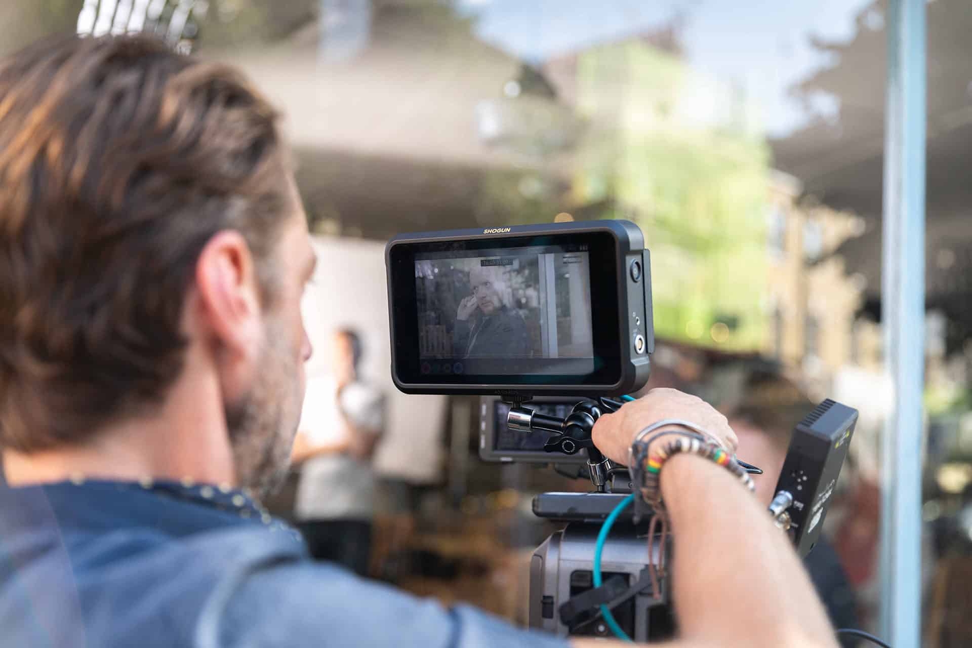 Checking a shot on an external monitor during filming